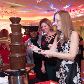 Guests enjoy the chocolate fountain at FA holiday party