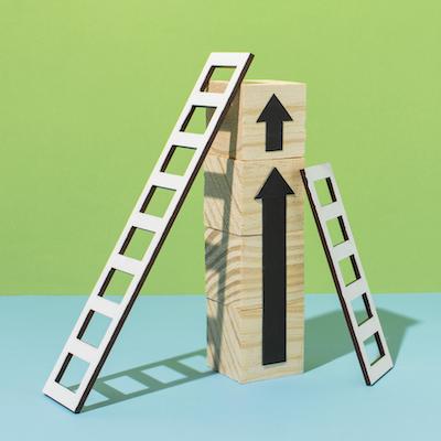 promotion image with ladders and wooden blocks pointing upward
